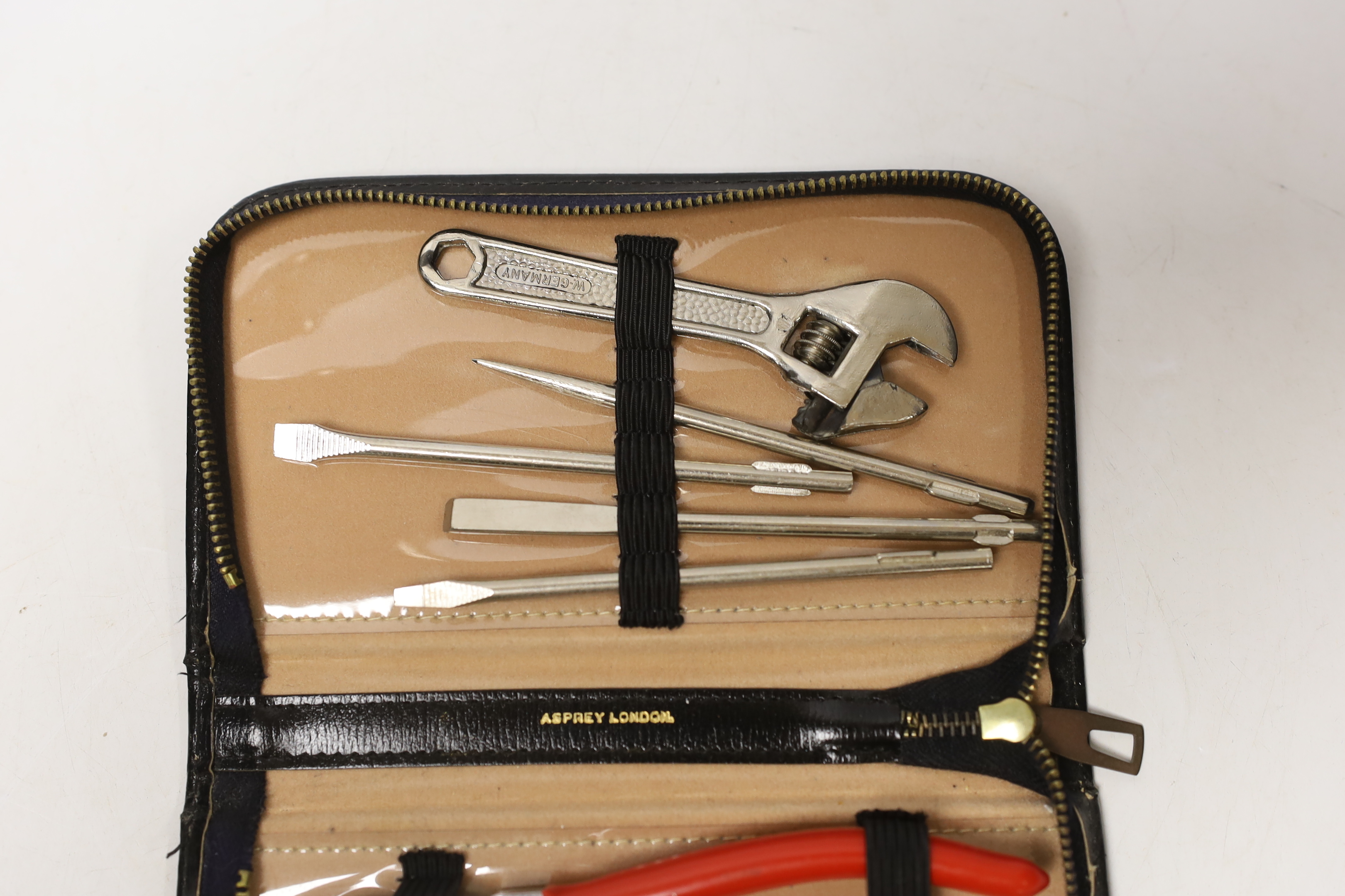 An Asprey case with associated tool set, case 17cm wide